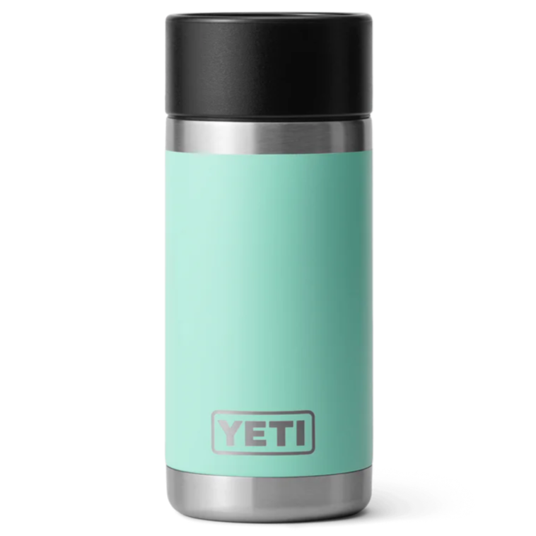 A seafoam green YETI Rambler 12oz HotShot Bottle with a black lid.